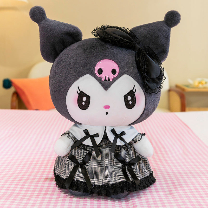 Giant gothic black bunny and pink rabbit plushie held by model in cozy room