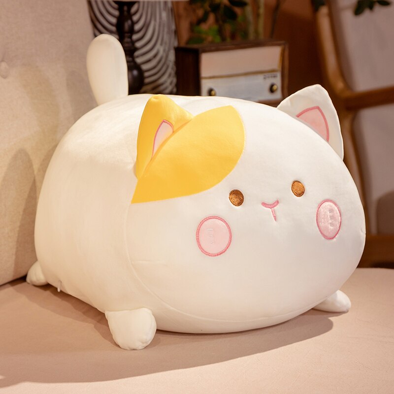 Chonky cat plushie in cozy lifestyle setting